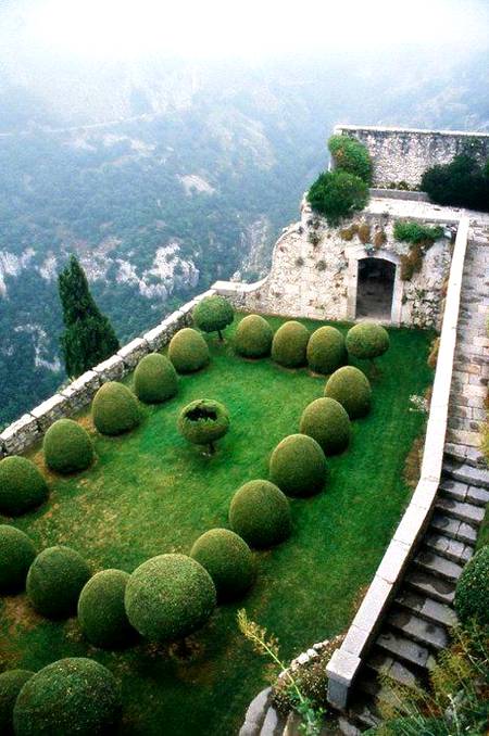 Chateau de gourdon Garden France___it reminds me of Alice in wonderland.