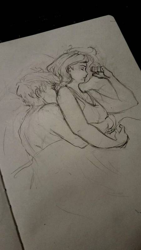 Sleeping couple on bed