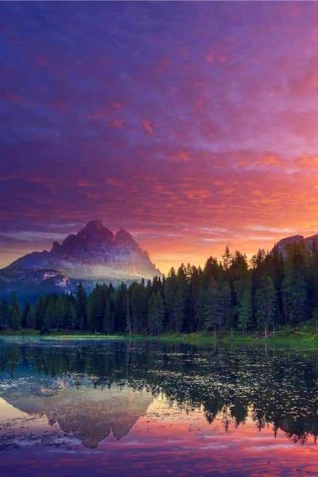 Mountain lake at sunrise italy