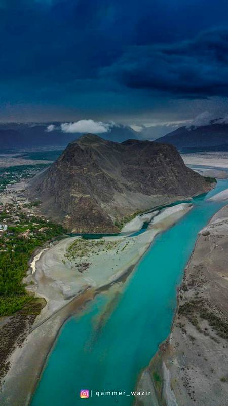 This pic shows crystal clean bluish Indus river along with Kharphocho fort and dark clouds in the background, 
Skardu GB!!