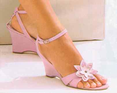 Pink wedge heeled sandals .
