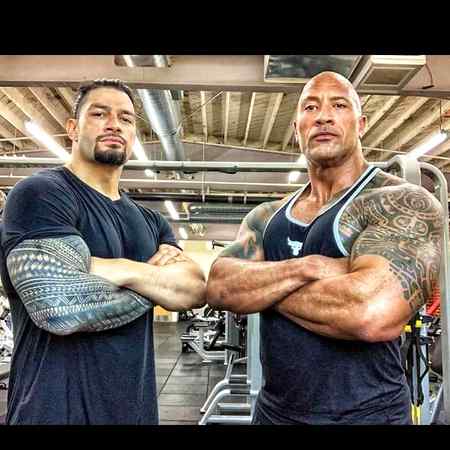 Reigns with his cousin The Rock 💀