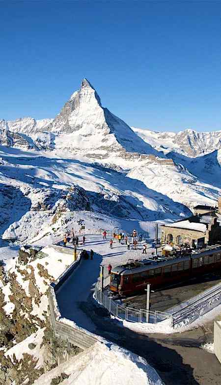 the rack and pinion train arrives at gornergrat station ,matterhorn, Italy