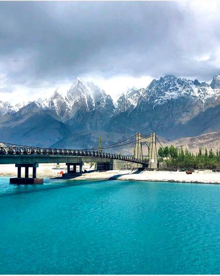 Saling bridge ,bluish shyok River and Hadi cones in the Background
