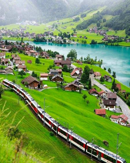 Beautiful view of this village and train also road👍