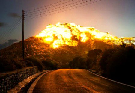 This mountain with the sun on it looks like an Explosion