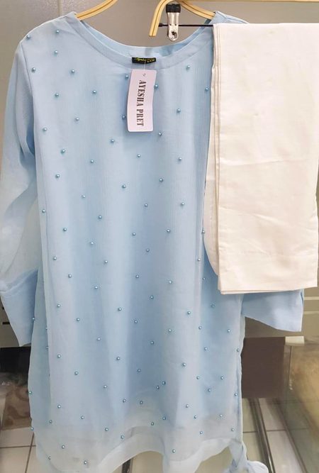 Me and my friend stitching a dress like this